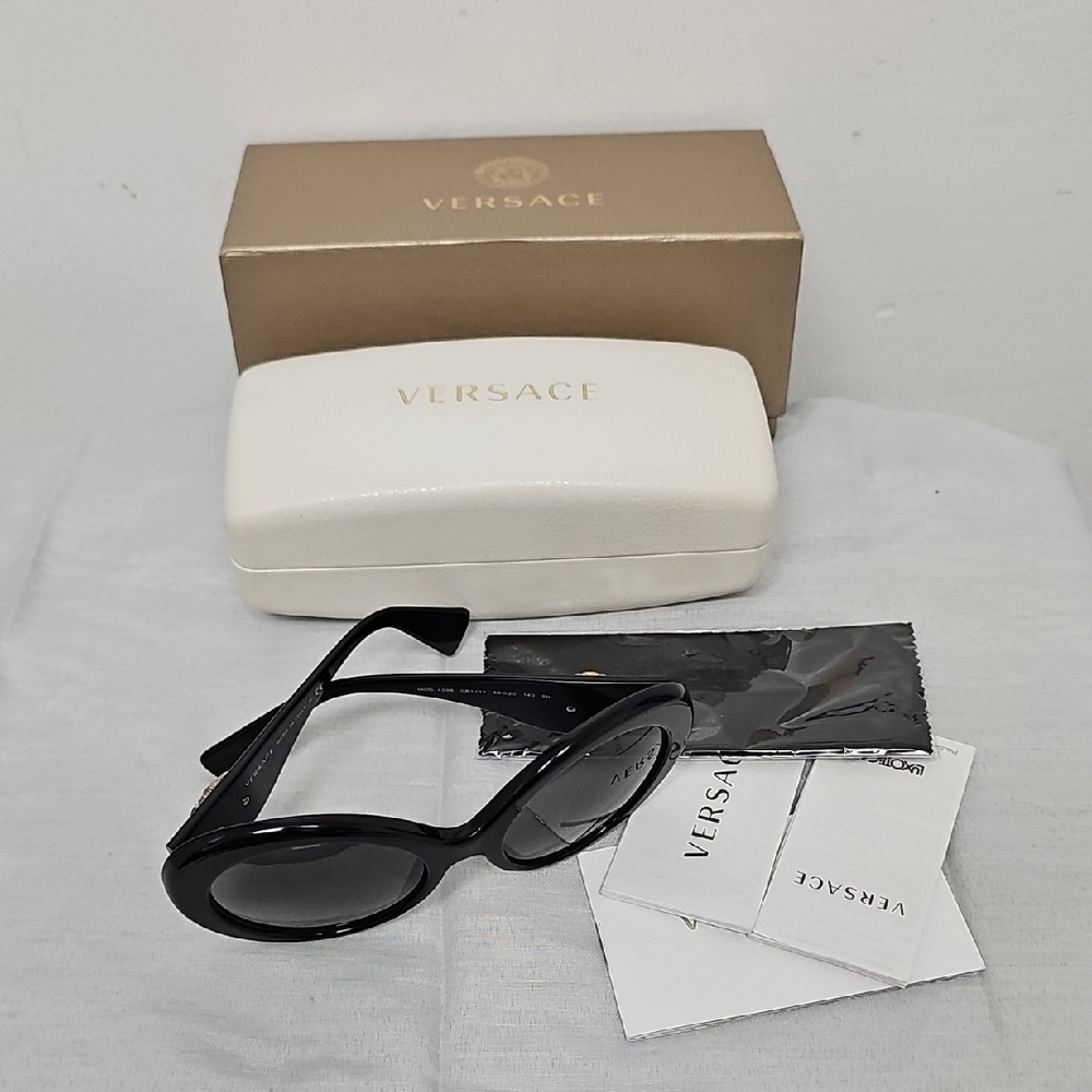 Versace Black Oval Women's Sunglasses with Gold Logo Accents